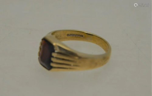 A 9ct yellow gold ring with rectangular garnet,