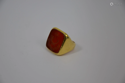 A large 18ct yellow gold signet ring with cornelian