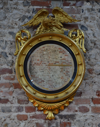 A 19th century giltwood framed circular mirror