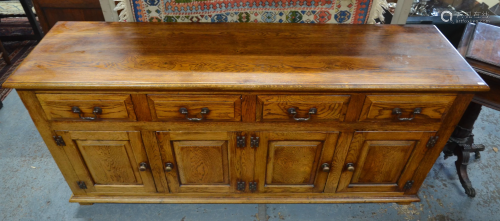 A good quality 18th style oak sideboard