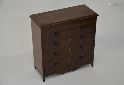 A 19th century mahogany miniature chest of…