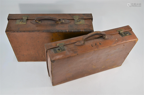 Two vintage leather suitcases