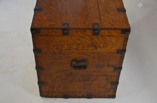 An antique steel bound oak trunk and contents