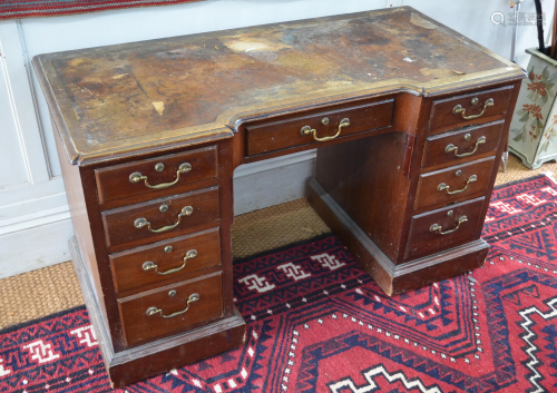 A Victorian mahogany pedestal desk with inverted