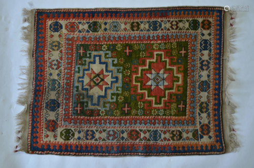 An antique Caucasian Kazak rug, 124cm x 90 cm