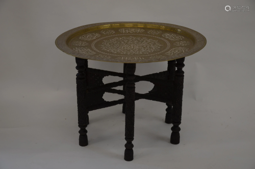 An Egyptian tray top table on folding stand