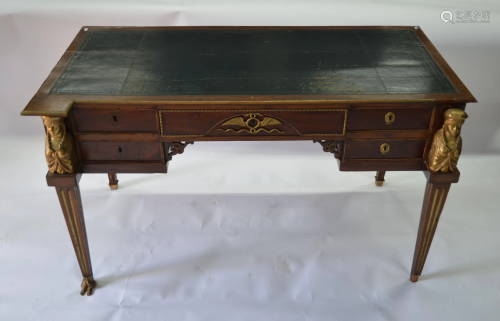 A French Empire-style gilt metal mounted bureau plat
