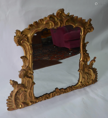 A George III giltwood framed overmantle mirror in …
