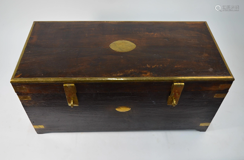 A brass bound hardwood trunk