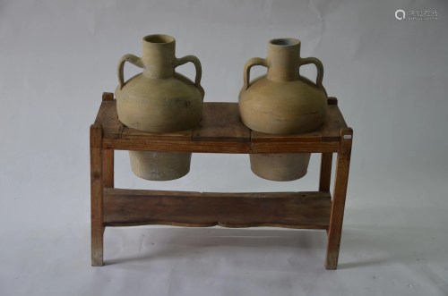 An antique pine jar stand with a companion pair…