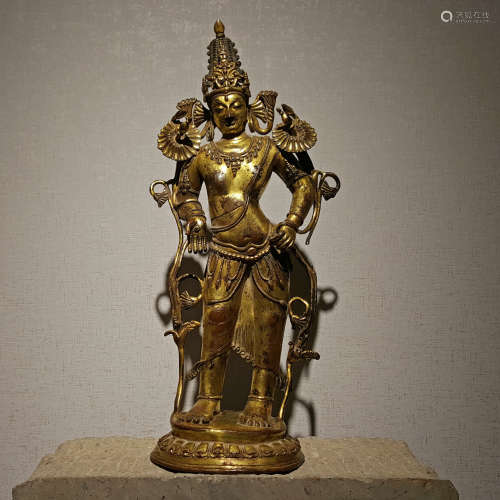 A YUAN DYNASTY BRONZE GILDED GUANYIN