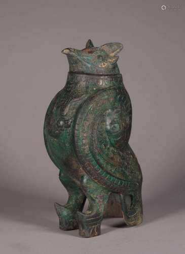 A WARRING STATES PERIOD BRONZE BIRD STATUE