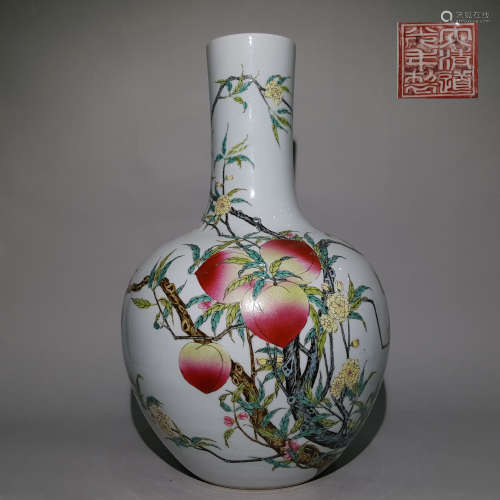A QING DYNASTY FAMILLE ROSE PASTEL BOTTLE WITH NINE PEACHES