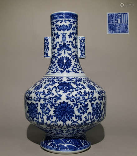 A QING DYNASTY BLUE AND WHITE LOTUS TUBE EAR ZUN