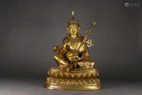 A QING DYNASTY BRONZE GILDED PADMA SAMBHAVA STATUE