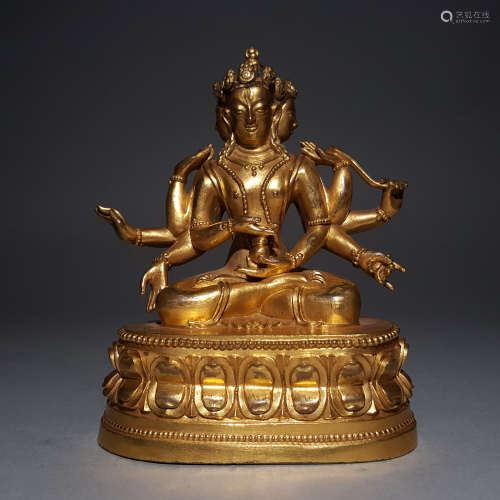 A MING DYNASTY BRONZE GILDED THOUSAND HANDED GUANYIN
