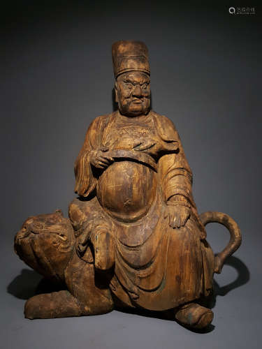 A MING DYNASTY WOOD CARVING OF ZHAO GONG MING