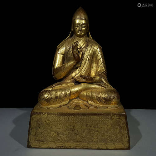 A MING DYNASTY BRONZE GILDED GURU BUDDHA