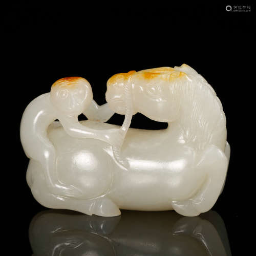 A Chinese White Jade Monkey On Horseback