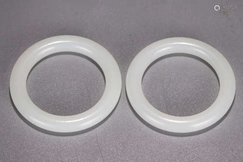 A Chinese White Jade Cape Rings, Pair