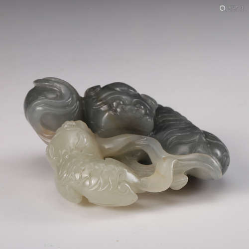 A Chinese Black And White Jade Foolions