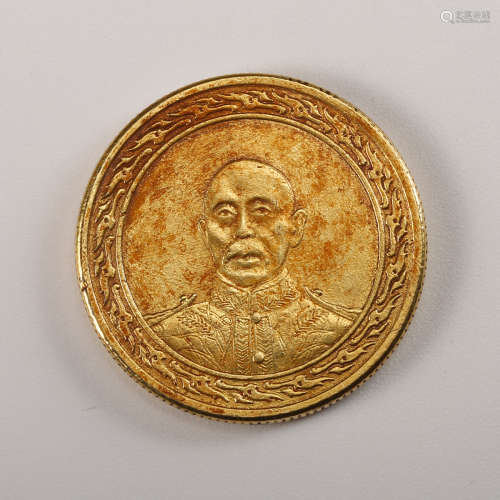 A Chinese Gilt Silver Coin