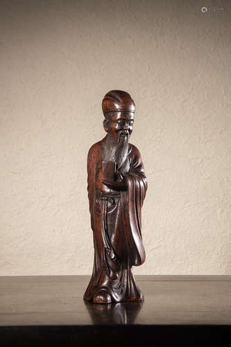 A Chinese Hardwood Carved Figurine