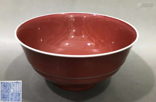 A RED GLAZE BOWL WITH MARK