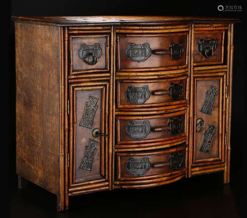 A BAMBOO CABINET WITH DRAWERS