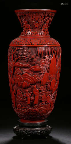 A RED LACQUER VASE CARVED WITH FIGURE PATTERN