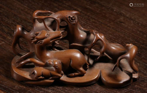 A HUANGYANG WOOD BRUSH HOLDER CARVED WITH BEAST
