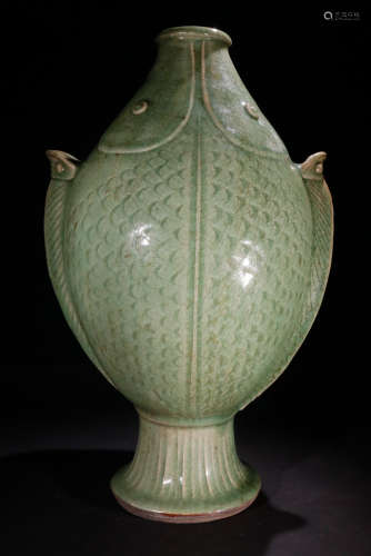 A GREEN GLAZE VASE SHAPED WITH FISH