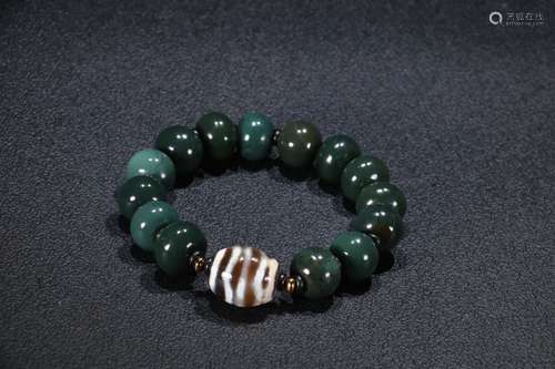 A Chinese Agate Bracelet With Dzi