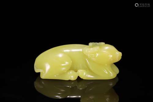 A Chinese Old Yellow Hetian Jade Bull-Shaped Ornament