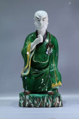 A Chinese Three-Color Arhat Porcelain Statue