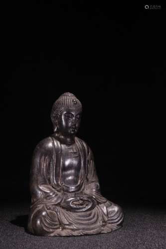 A Chinese Rosewood Buddha