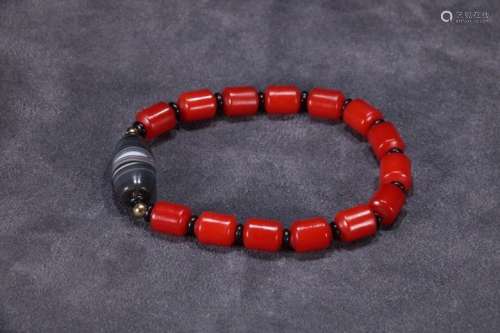 A Chinese Red Agate Bracelet With Dzi
