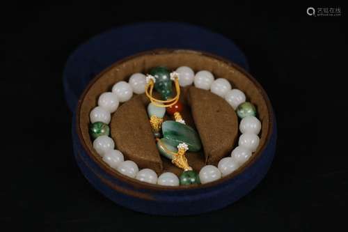 A Chinese Hetian Jade Bracelet With Jadeite Bead