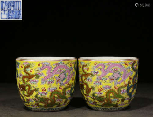 PAIR OF FAMILLE ROSE YELLOW GROUND 'DRAGONS' CUPS