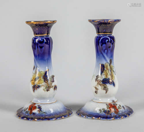 Pairs of English Enameled Porcelain Candle Sticks