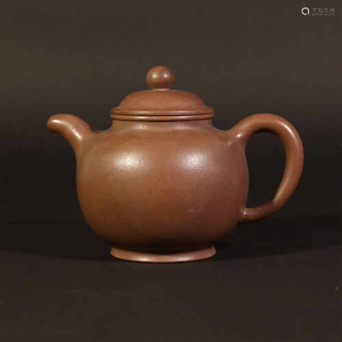 dark-red enameled pottery teapot