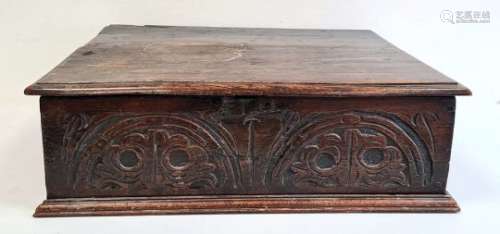 Antique carved oak bible box, the rectangular top with moulded edge, the carved front panel on