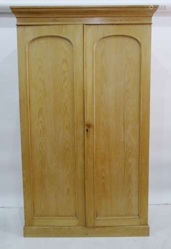 Late 19th century compactum wardrobe in pine, cavetto moulded cornice above two arched panelled