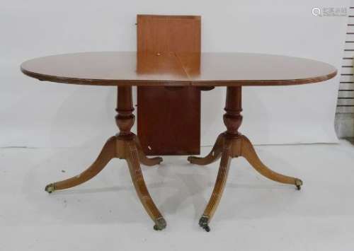 Mahogany and crossbanded D-end Regency style dining table with reeded edge raised on two pedestals