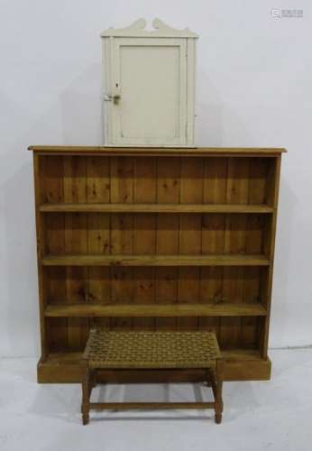 Pine open bookcase with plinth base, string top stool and cream painted wall hanging cabinet 112 x