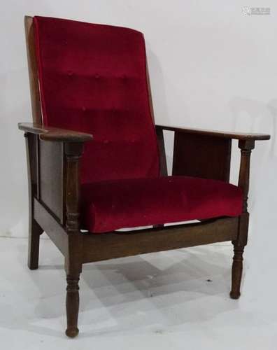 Early 20th century oak framed reclining chair with red upholstered seat and back