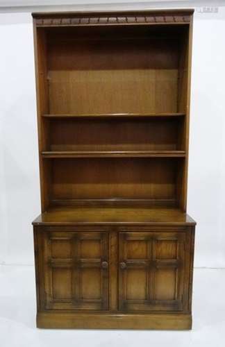 Ercol mid elm 20th century shelving unit with adjustable shelves above a base of two panelled