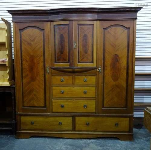 19th century wardrobe compactum with dentil cornice above two short bowed doors, above two short and