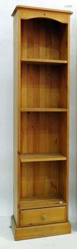 Modern narrow pine bookcase with drawer under, raised on plinth, 45cm x 180cm