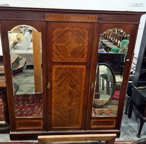 19th century mahogany three-door wardrobe with ogee moulded cornice above panelled central and